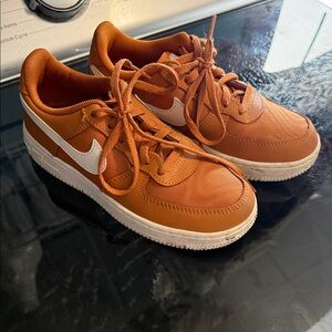 Nike youth Air Force Ones Rust Orange Low-Top Sneakers with White Swoosh